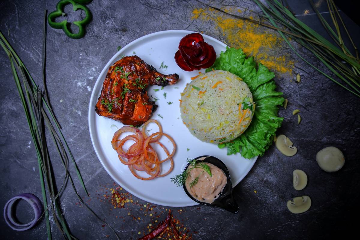 Before/after photos showing the transformation of a simple chicken dinner to a gourmet meal